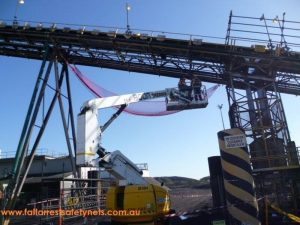 Red Conveyor Safety Net being installed at mine site